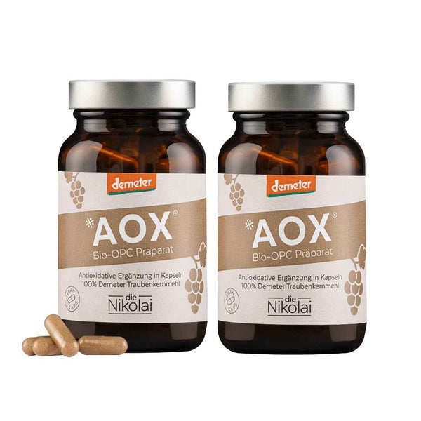 Zwei dieNikolai AOX Bio-OPC-Präparate in braunen Glastiegeln mit Demeter-Siegel und Vegan-Caps – antioxidative Nahrungsergänzung aus Demeter Traubenkernmehl